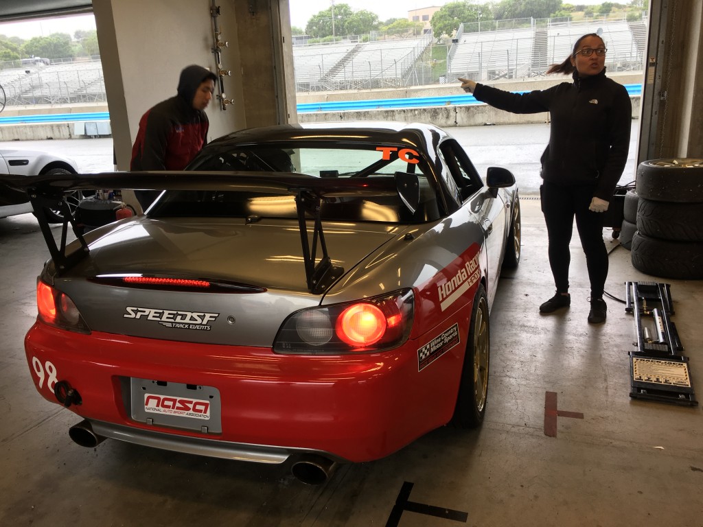 With rain tires on and the S2000 off of the QuickJack, Lee-Anne Ostby directs Hartanto out to the grid